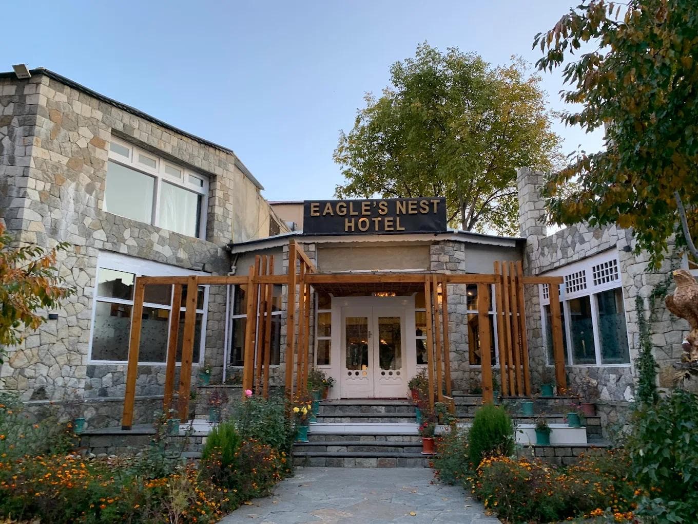 Eagle's Nest Hotel perched on the highest ridge of Hunza Valley with sweeping views of Rakaposhi and Lady Finger peaks at sunrise
