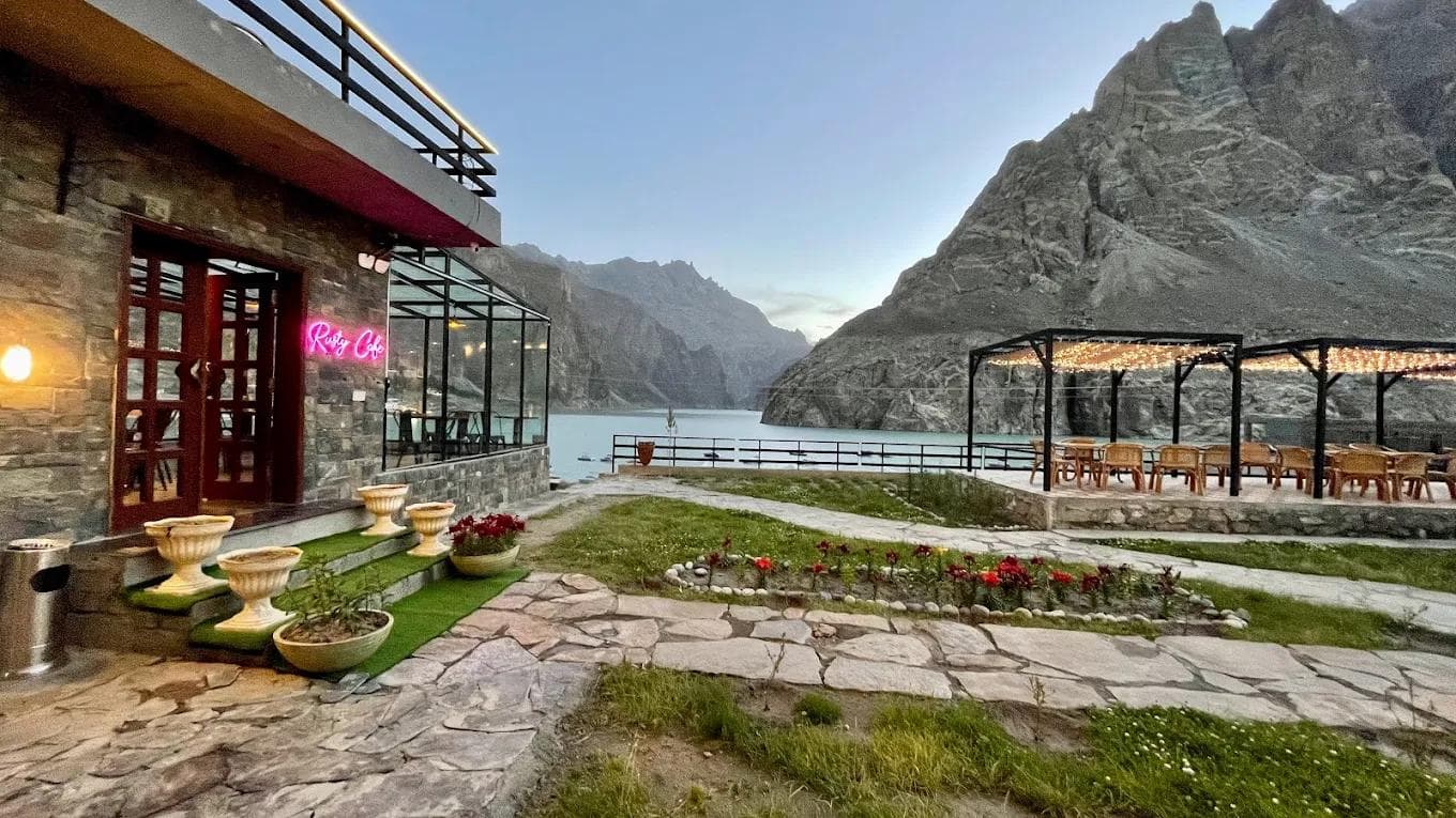 Horizon Resort lakeside cabin at Attabad Lake with turquoise blue water and dramatic mountain reflections